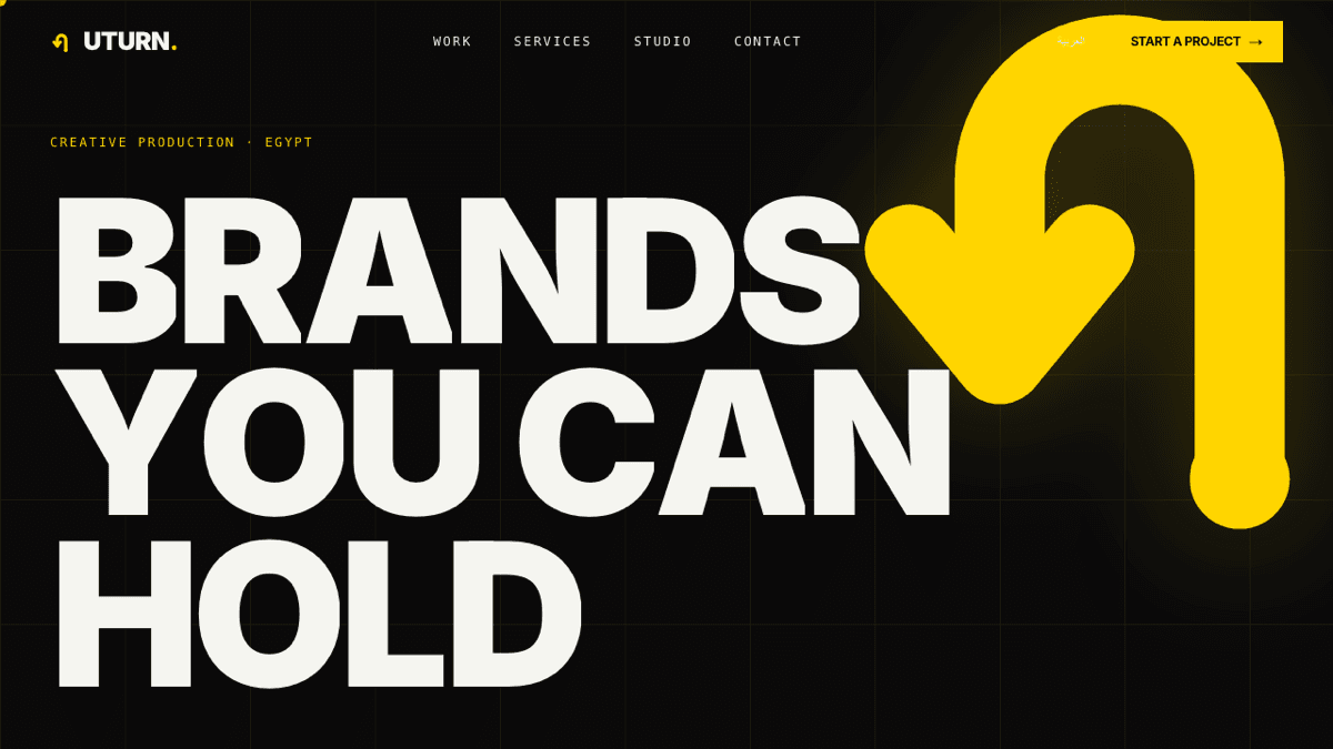 UTURN. Advertising: bilingual EN/AR creative-production studio site, heavy yellow wordmark on black with a U-turn arrow mark.